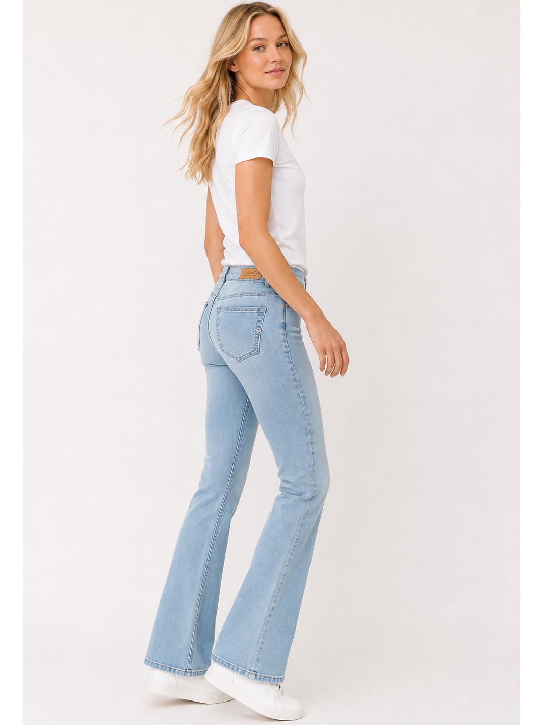 Cava Flare Jean – Ice Blue — full body side facing styled image | Bianco Jeans