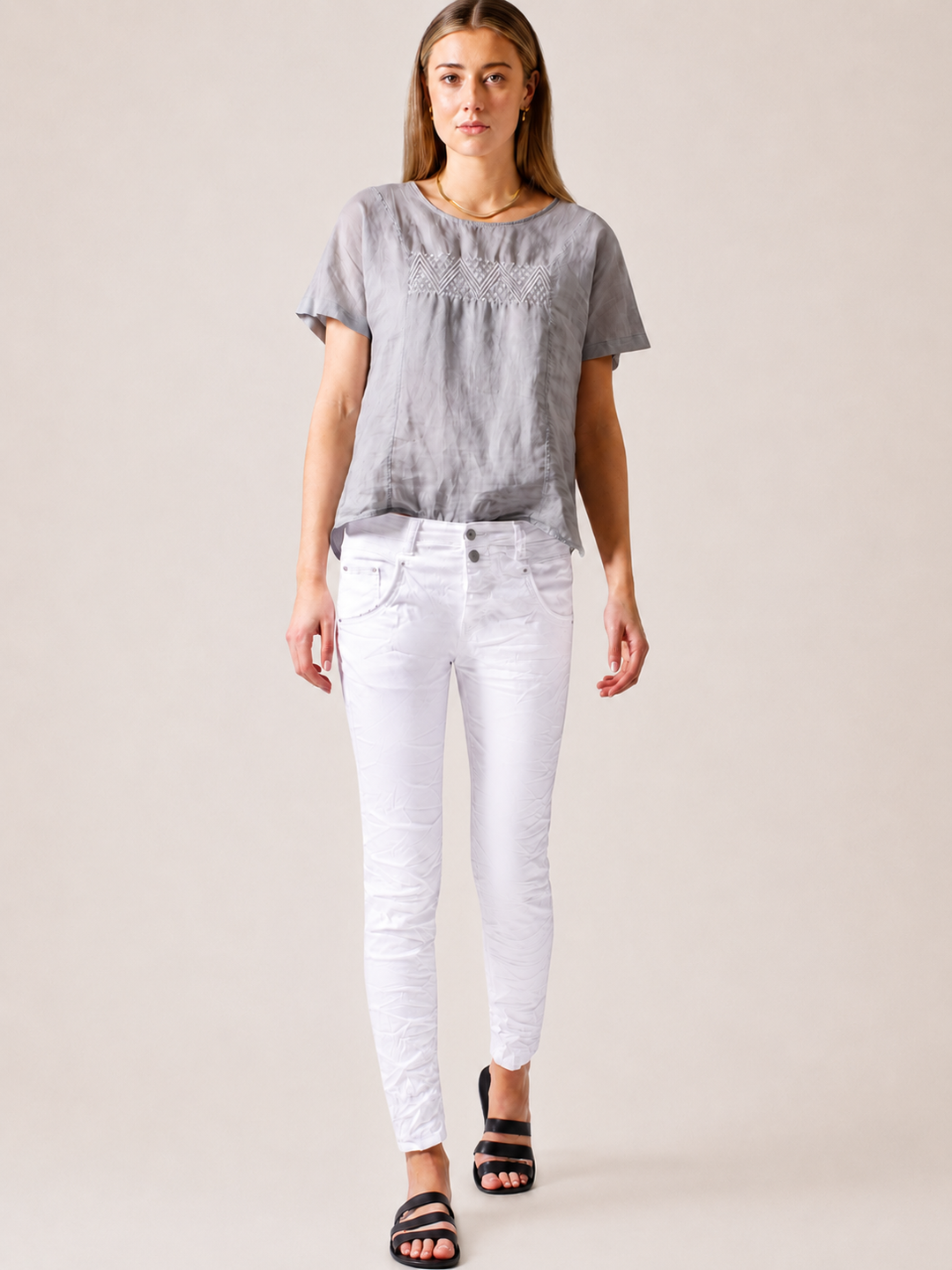 Blake White Slim Boyfriend Pant — full body front facing styled image with movement | Bianco Jeans