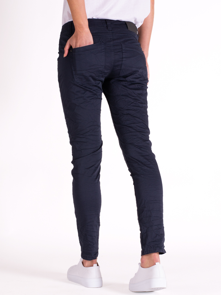 Blake Graphite Slim Boyfriend Pant — half body back view at a side angle | Bianco Jeans