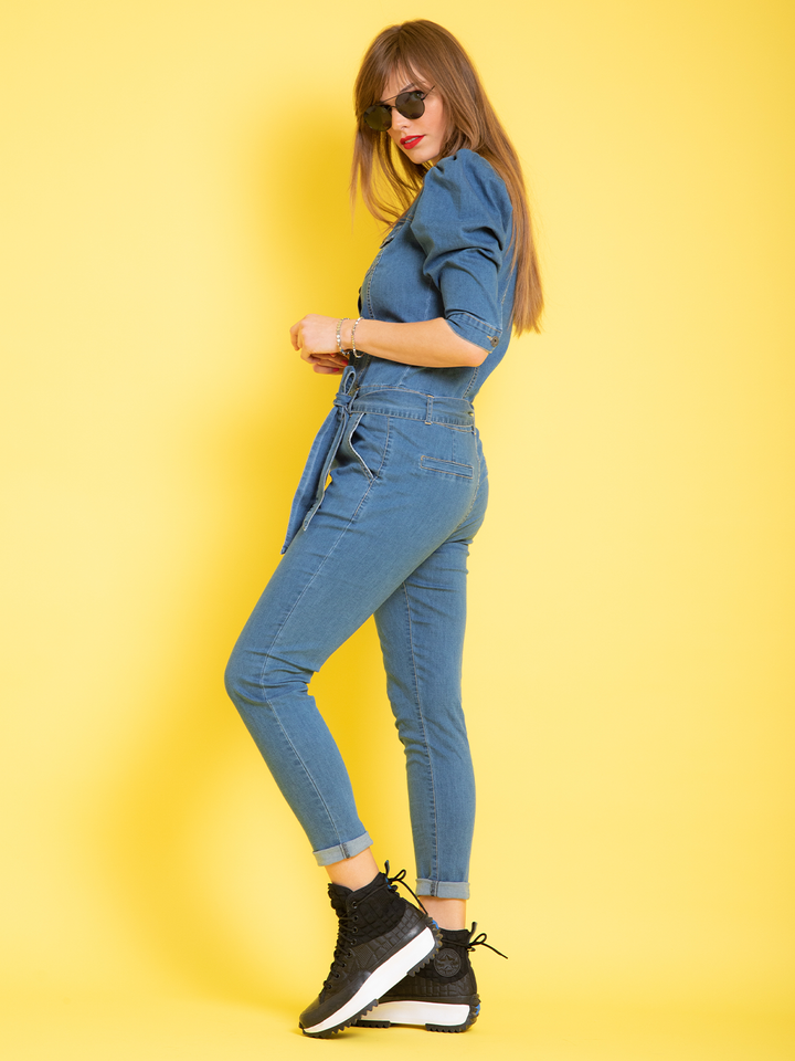 Nina Denim Jumpsuit — full body side view, tapered leg silhouette with zip fly and 3/4 sleeves | Bianco Jeans