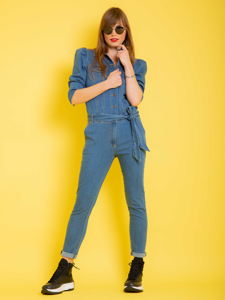 Nina Denim Jumpsuit — full body front view, model with hand under chin styling stretch denim jumpsuit | Bianco Jeans