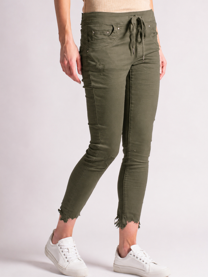 Samantha Olive Jogger — half body side view with movement | Bianco Jeans